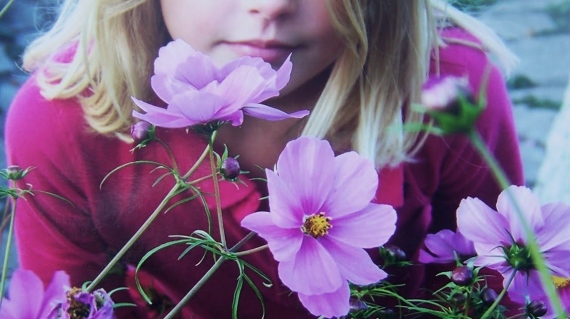 Elise Photo smelling the flowers